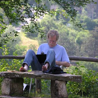 Steve Trenam writing poetry in Tuscany
